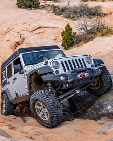 8W9A5873 Jeep Camper climbing an obstacle in Moab Utah