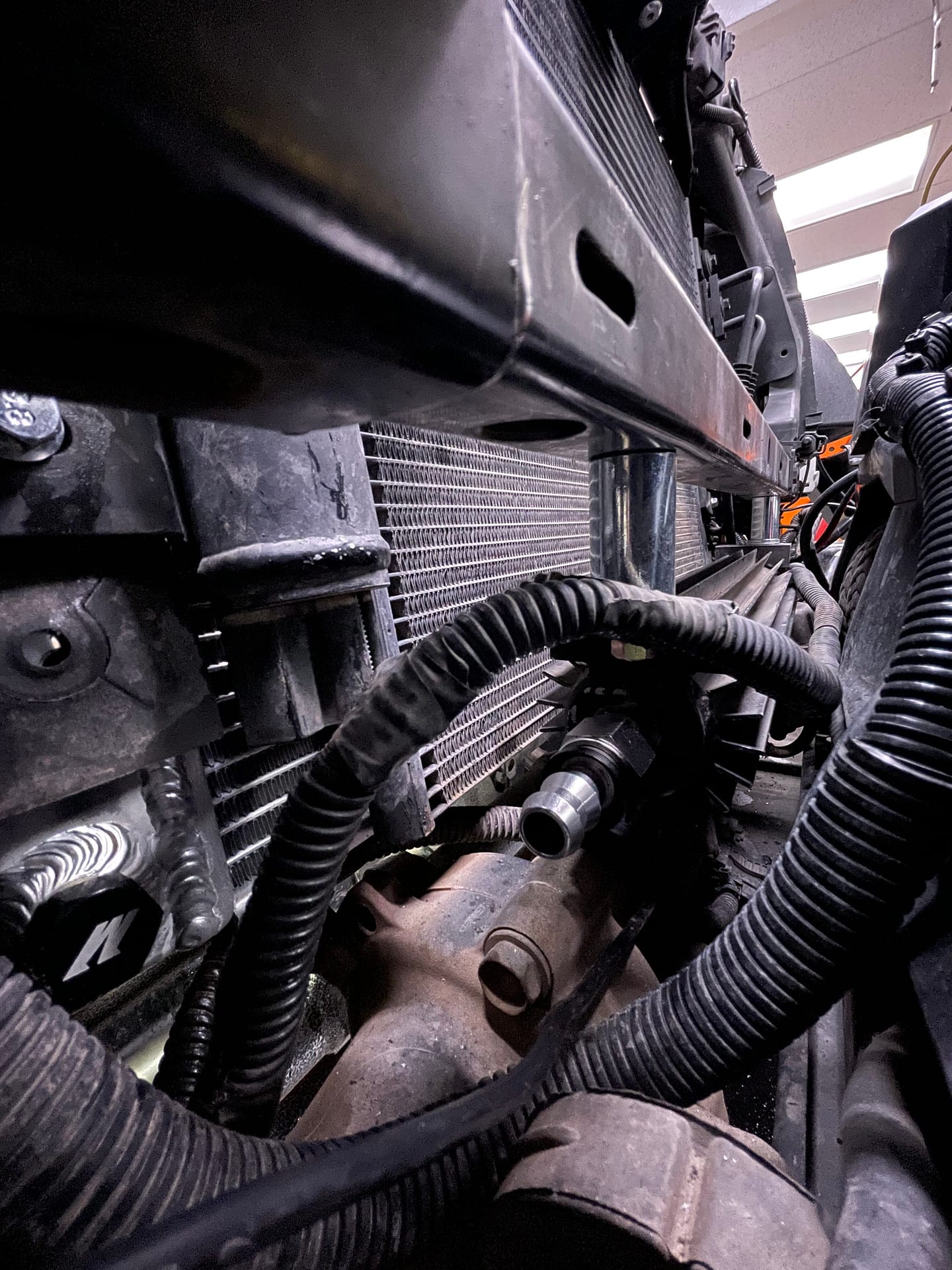 The solution to our Jeep wrangler overheating at highway speed: PSC cooler relocated to below lower radiator support