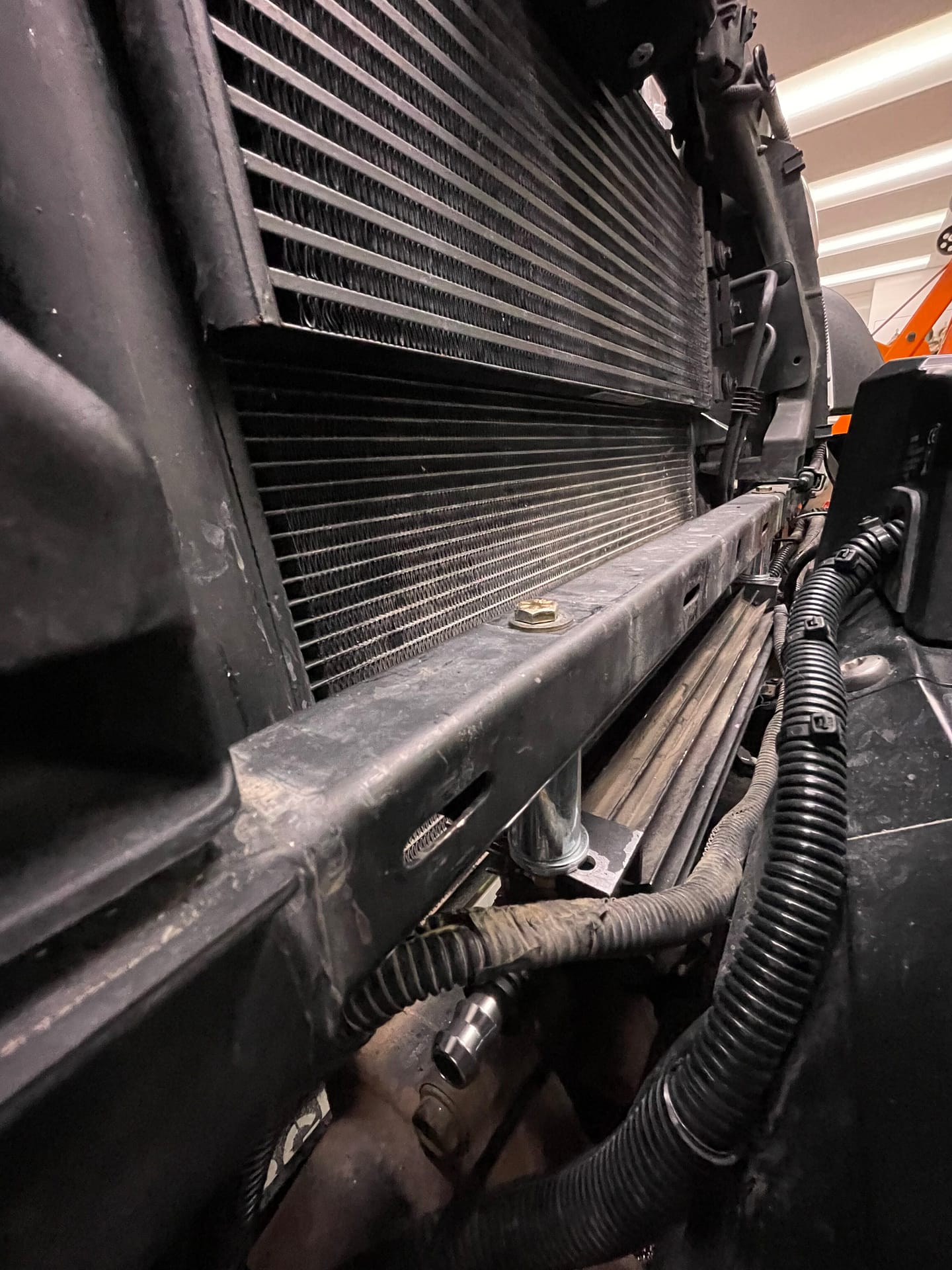 PSC cooler relocated to below lower radiator support